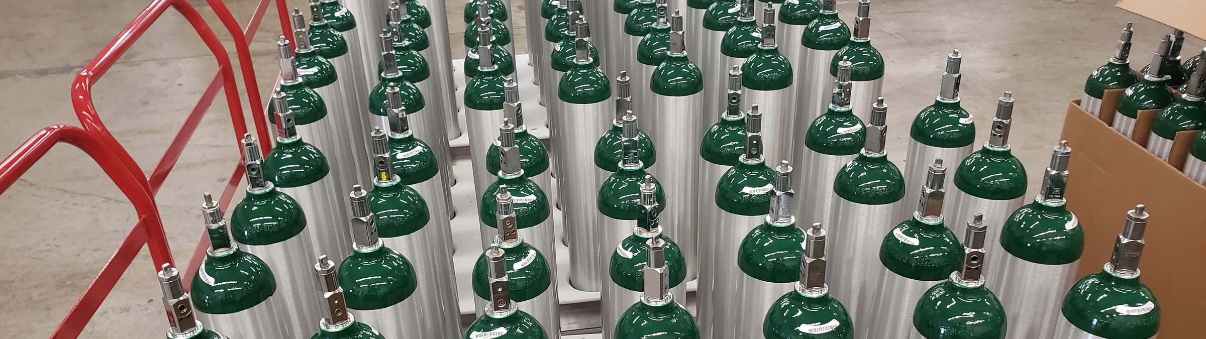 Cylinders staged in rows on the shop floor